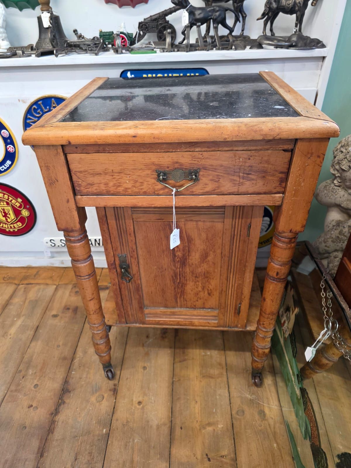 Antique side table on wheels